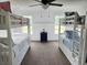 Bedroom featuring white bunk beds, neutral carpet, and a window with scenic views at 675 Liberty Church Rd., Loris, SC 29569