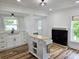 Charming kitchen with white cabinets, butcher block island, and fireplace at 675 Liberty Church Rd., Loris, SC 29569