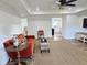 Bright living room featuring a comfortable rust-colored couch, tray ceiling, and a neutral rug at 675 Liberty Church Rd., Loris, SC 29569
