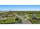 Aerial view of buildings and streets, many trees are visible with the ocean, the skyline, and clear blue skies in the background at 6804 N Ocean Blvd. # 1049, Myrtle Beach, SC 29572