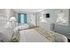 This bedroom includes two beds, a dresser with a TV, and light blue walls at 6804 N Ocean Blvd. # 1133, Myrtle Beach, SC 29572