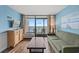 Comfortable living room with balcony access and ocean views at 6804 N Ocean Blvd. # 1133, Myrtle Beach, SC 29572