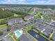 Aerial view features a community pool, ponds, and a parking area at 719 Shearwater Ct. # 301, Murrells Inlet, SC 29576