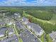 Overhead view showcasing condo complex and surroundings, including a golf course and pond at 719 Shearwater Ct. # 301, Murrells Inlet, SC 29576