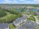 This aerial view showcases the property near golf course, pond, parking and residential community at 719 Shearwater Ct. # 301, Murrells Inlet, SC 29576