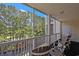 Relaxing balcony with chairs and views of the wooded scenery and a creek at 719 Shearwater Ct. # 301, Murrells Inlet, SC 29576