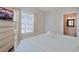 Bright bedroom with a TV and view into the en-suite bathroom at 719 Shearwater Ct. # 301, Murrells Inlet, SC 29576