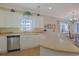 Bright kitchen with stainless steel appliances, spacious countertop and an open view to the dining room at 719 Shearwater Ct. # 301, Murrells Inlet, SC 29576