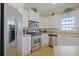 Well-equipped kitchen features stainless steel appliances, ample counter space, and plenty of storage at 719 Shearwater Ct. # 301, Murrells Inlet, SC 29576