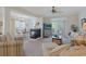 Spacious living room with fireplace open to dining area with views of the outdoor balcony at 719 Shearwater Ct. # 301, Murrells Inlet, SC 29576