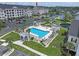 Aerial view of community pool, cabana, and well-maintained landscaping at 719 Shearwater Ct. # 301, Murrells Inlet, SC 29576