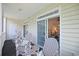 Cozy porch with comfortable seating and convenient access to the bright living room at 719 Shearwater Ct. # 301, Murrells Inlet, SC 29576