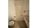 Bathroom with standard toilet and sink, and tile flooring at 7500 N Ocean Blvd. # 6120, Myrtle Beach, SC 29572