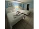 Bright bedroom featuring two beds, white bedding, decorative swan towels, and neutral tile floors at 7500 N Ocean Blvd. # 6120, Myrtle Beach, SC 29572