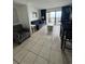 Comfortable living room area with ocean views from sliding glass doors at 7500 N Ocean Blvd. # 6120, Myrtle Beach, SC 29572