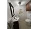 Bathroom with a vanity, mirror, toilet, neutral tile floor and decorative art on the wall at 7509 N Ocean Blvd. # 1205, Myrtle Beach, SC 29572