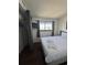 Bedroom featuring a TV, closet with privacy curtains and an exterior view at 7509 N Ocean Blvd. # 1205, Myrtle Beach, SC 29572