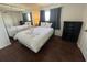 Bedroom with wood-look flooring and a queen-sized bed, swan towel art, and mirrored closet doors at 7509 N Ocean Blvd. # 1205, Myrtle Beach, SC 29572