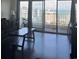 Living room featuring hardwood floors, large windows, ocean views, and a table at 7509 N Ocean Blvd. # 1205, Myrtle Beach, SC 29572