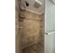 Tiled walk-in shower with glass door, shower caddy, and shower head at 7509 N Ocean Blvd. # 1205, Myrtle Beach, SC 29572