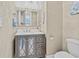 Bathroom features a gray vanity with designer mirror and cabinet inlays, with a modern faucet at 830 Shine Ave. # 28 R8, Myrtle Beach, SC 29577