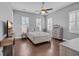 Bedroom with hardwood floors, ceiling fan and plantation shutters, and coastal decor at 830 Shine Ave. # 28 R8, Myrtle Beach, SC 29577