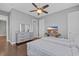 Comfortable bedroom with light gray walls, ceiling fan, wood floors, and tasteful nautical decor at 830 Shine Ave. # 28 R8, Myrtle Beach, SC 29577