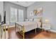 Well-lit bedroom with hardwood floors, natural light, and minimalist decor at 830 Shine Ave. # 28 R8, Myrtle Beach, SC 29577