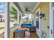 Relaxing front porch featuring comfortable blue seating and decorative outdoor accents at 830 Shine Ave. # 28 R8, Myrtle Beach, SC 29577