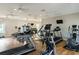 Bright gym features modern exercise machines, TVs and ceiling fans for a great workout experience at 830 Shine Ave. # 28 R8, Myrtle Beach, SC 29577