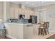 Bright eat-in kitchen featuring stainless steel appliances, pendant lighting, and granite countertops at 830 Shine Ave. # 28 R8, Myrtle Beach, SC 29577