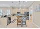 Bright eat-in kitchen featuring stainless steel appliances, pendant lighting, and granite countertops at 830 Shine Ave. # 28 R8, Myrtle Beach, SC 29577