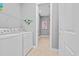 Functional laundry room featuring a washer, dryer, and ample storage shelves at 830 Shine Ave. # 28 R8, Myrtle Beach, SC 29577