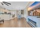 Open-concept living space with wood floors, modern decor, and a view of the kitchen and dining area at 830 Shine Ave. # 28 R8, Myrtle Beach, SC 29577