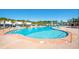 A large resort style pool with various entry points and surrounding lounge furniture at 830 Shine Ave. # 28 R8, Myrtle Beach, SC 29577