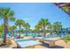 Community rec area featuring picnic tables, lawn chairs, and ping pong tables under the warm sun at 830 Shine Ave. # 28 R8, Myrtle Beach, SC 29577