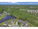 Aerial view of home with red pin showing the location on the property near a pond at 9232 Goodwill Ct., Myrtle Beach, SC 29579
