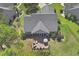 Aerial view of the home showing a screened in porch, patio, and well-manicured lawn at 9232 Goodwill Ct., Myrtle Beach, SC 29579