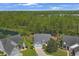 Aerial view of home with a well manicured front yard, driveway, and attached garage at 9232 Goodwill Ct., Myrtle Beach, SC 29579