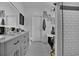 Modern bathroom featuring a double sink vanity, tiled shower, and decorative accents at 9232 Goodwill Ct., Myrtle Beach, SC 29579