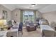 Bedroom with a desk and a chair, a daybed and a large window with backyard views at 9232 Goodwill Ct., Myrtle Beach, SC 29579