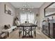 Elegant dining room with a modern chandelier, a wooden table, and stylish decor at 9232 Goodwill Ct., Myrtle Beach, SC 29579
