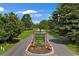 Community entrance with mature trees and colorful flowerbeds at 9232 Goodwill Ct., Myrtle Beach, SC 29579
