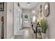 Bright foyer with hardwood floors, a decorative table, and access to the rest of the home at 9232 Goodwill Ct., Myrtle Beach, SC 29579