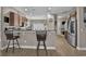 Open kitchen with modern barstool seating, stainless steel appliances, and lots of natural light at 9232 Goodwill Ct., Myrtle Beach, SC 29579