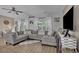 Cozy living room with a sectional sofa, large windows, and stylish decor at 9232 Goodwill Ct., Myrtle Beach, SC 29579