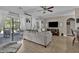 Spacious living room with hardwood floors, a comfortable sofa, and a view of the backyard at 9232 Goodwill Ct., Myrtle Beach, SC 29579