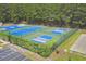 Aerial view of community sport courts featuring tennis courts, pickleball courts, and a basketball court at 9232 Goodwill Ct., Myrtle Beach, SC 29579