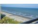 Panoramic beach view from a condo balcony, showcasing the pristine shoreline and inviting ocean waters at 9820 Queensway Blvd. # 1603, Myrtle Beach, SC 29572