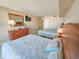 Bedroom featuring two queen beds, wooden dresser, and decor at 9820 Queensway Blvd. # 1603, Myrtle Beach, SC 29572